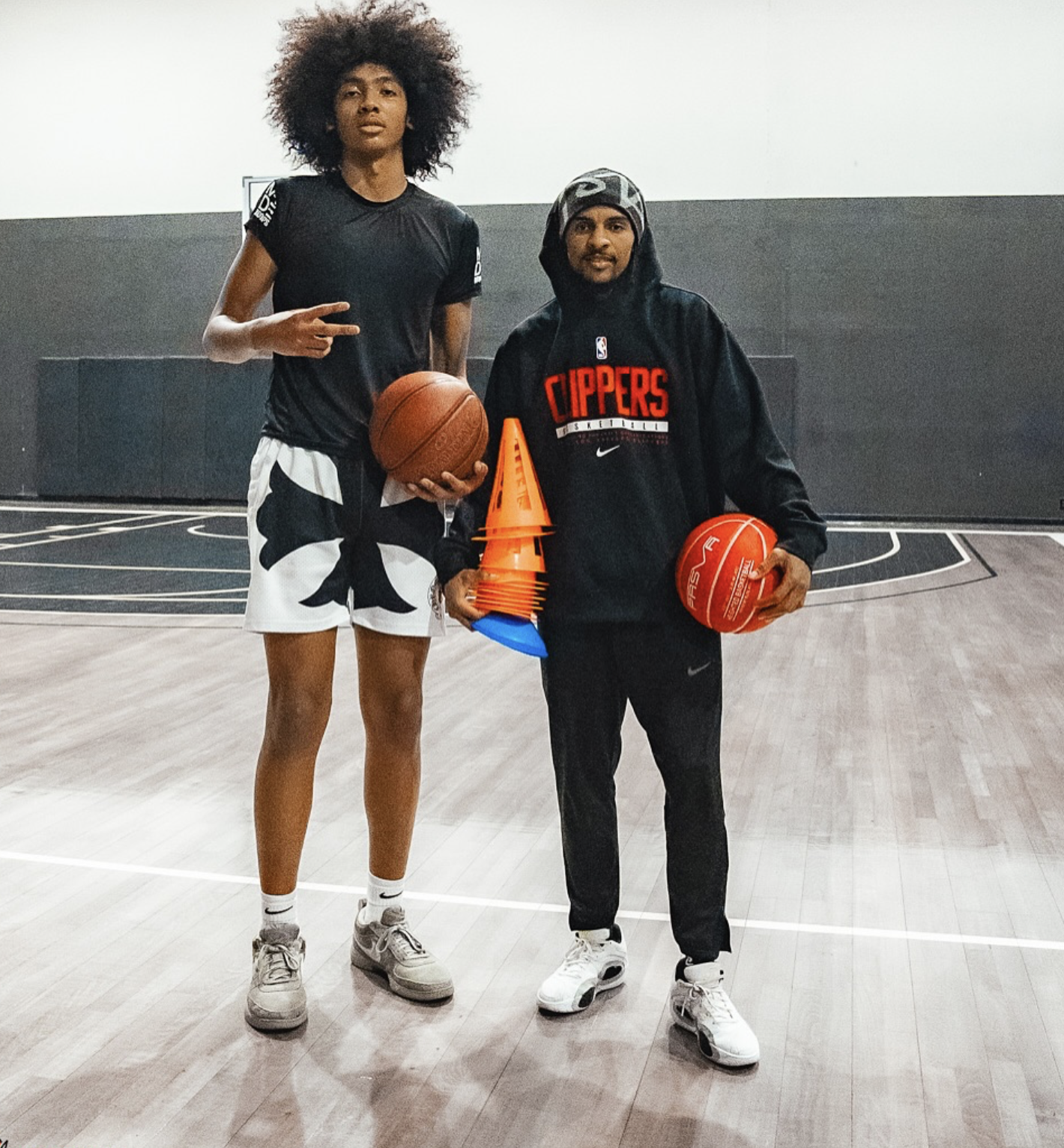 Andre Winn training an athlete on the court